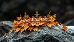 Golden crown with golden leaves on a wet rock,snow ,dark backround