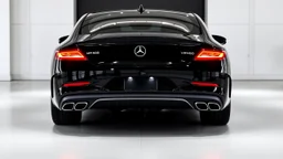 Full image of the rear view of a black Mercedes-Benz CLS with lights on