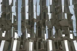 The museum's exterior facade is made of modern mirrors