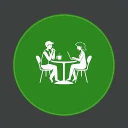 A circular logo in a distinctive green color with two people sitting around a two-person table in the center, one drinking coffee and the other working on their laptop.