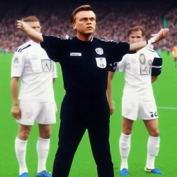 Leonardo Di Caprio in a referee jersey officiating for a soccer match at Wembley Stadium