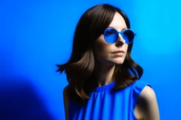 advertising photography, plain blue background, pop style photography, woman in blue dress, brunette, round sunglasses, real photography, 16K, shot with Leica camera, 35 mm lens, indirect lighting,