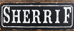 large and wide hand painted old western sign that reads: "SHERRIF" white on black with inset boarder stripe in white aged