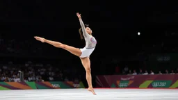 Please provide a detailed Photo of a female gymnast performing her routine on the floor exercise at the Olympic Games. Include specific elements of her performance, such as her choreography, the difficulty of her moves, her artistry, and how she engages the audience. Additionally, describe the atmosphere of the event, the reactions of the crowd, and any notable aspects of her presentation. The output should be structured in a way that captures the excitement and technical skill of the performanc