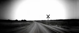 old wester railroad crossing a dirt road , grayscale, oval fade boarder vignette