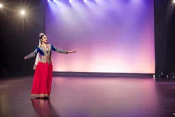azeri female full bdy with traditional dance clothing in modern stage in a royal hall