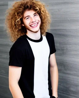 A skinny and high guy with wild curly blond hair, smiling with teeth and wearing black skinny jeans and a t-shirt