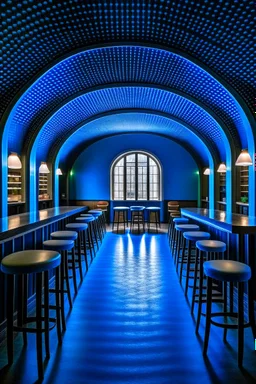 A restaurant whose outer walls are oval in shape and its interior is blue and its floor is light with a bar table in the middle of the restaurant in the shape of an oval containing 30 chairs and there are no windows in the restaurant