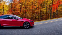 A Tesla's 'Model S Plaid' is racing at top speed, across the 'Great Smoky Mountains' National Park, in Tennessee. CINEMATIC. WIDE ANGLE LENS. PHOTO REAL.