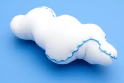 white plushie stuffed toy clouds with blue yarn stitching around edge, blue background