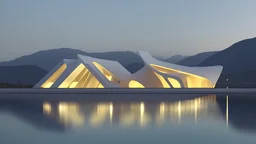 A modern architectural structure with irregularly shaped holes illuminated from within at night, a person standing in the doorway, and a body of water in the foreground with mountains in the background