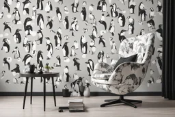 penguin shaped and penguin coloured (black and white) armchair in a modern room, with human feet decorated wallpaper in the background in sunshine