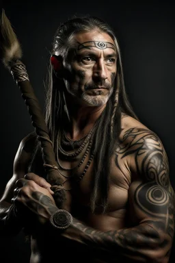 clean shaven middle aged long haired celtic warrior with tribal tattoos and spear