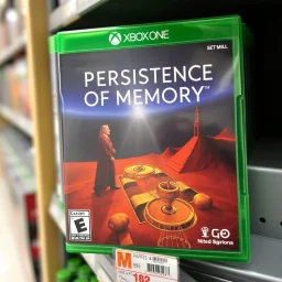 close up on a Xbox One video game case on display on a store shelf for game titled text "Persistence of Memory", game case image is a replica of "Persistence of Memory'' painting by Dali, surrealism, rated M for mature