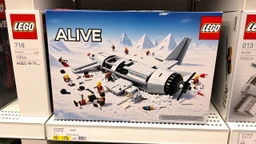 display of a box of the connecting brick-based Lego set labelled "ALIVE" on a store shelf. Box picture features lego constructed image of a badly broken up crashed fuselage buried in the snow all made in legos, dystopian, broken plane pieces strewn about, lego soccer uniform characters laying in snow, Andes in background, showing the detail of raised lego pips on tops of all surfaces, Intricate detail. Satire. text "Ages 19-75", displays the manufacturer's logo