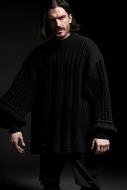 Man's large and long and black knitted Poliedric jumper and bell shape sleeves