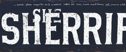 wide hand painted old sign that reads: "SHERRIF" white on black with inset boarder stripe in white