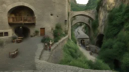 cobbled street with buildings and shops cut from rock, over hanging cliff face, arches, and bridges