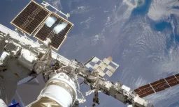 a astronaut repairing iss, a shot from very far away