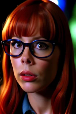 girl with ginger hair in a fringe with glasses and a septum piercing watching austin powers on tv