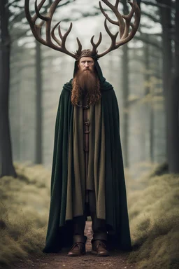 head to toe photo of a Celtic man in a cloak with antlers growing from the top of his head