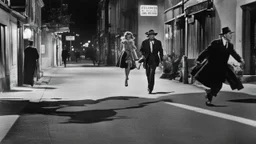 Creatures from 'Fiend without a face' chasing a woman down a street, 1950s noir