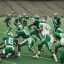 Placeholder: Boston Shamrocks Football team playing against the Toronto Rifles Football team,vintage, hyper-realistic, in color