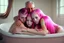 Placeholder: digital art of beautiful young pink hair teenage girls with dad in the bedroom in a bathtub with grandpa hugging bare lips