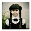 Placeholder: wednesday addams as a child, braids, frange, with black roses, worn polaroid, 1970s