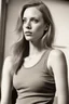 Placeholder: photo, rule of thirds, deborah ann woll dramatic lighting, short hair, detailed face, detailed nose, woman wearing tank top, smirk, realism, realistic, raw, analog, woman, portrait, photorealistic, analog, realism