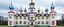 Placeholder: A white cloudy sky with a puffy palace designed in Matryoshka dolls painted by Piet Mondrian