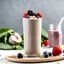 Placeholder: a protein shake cocktail made out of spinach, berries, a bit of oats, chia seeds, protein powder in a tall glass with berries on top. white simple background with no additional food