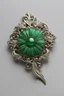 Placeholder: A green brooch