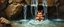 Placeholder: master oil painting by Rembrandt,cute blind trolls bading baby inside waterfall