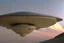 Placeholder: angelina jolie riding a flying saucer flying over future alien city close up of angelina jolie