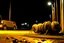 Placeholder: anthropomorphic pumpkin centipede hybrid hiding behind dumpster in a Wal-Mart parking lot at night, horror, dashboard cam, high film grain, low contrast, night vision