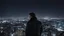 Placeholder: An Englishman in a bomber jacket standing at the top of a tall building looking across a city at night