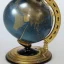 Placeholder: fantasy world globe, black marble, pearl inlay, fine gold detail, marginalia