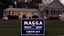 Placeholder: trump and maga 2024 campaign signs all over lawn