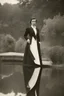 Placeholder: [vintage] A woman in tuxedo around a pond