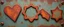 Placeholder: these shapes embossed in rusty metal on contrasting background