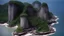 Placeholder: a scenario by the sea in borneo in the 1960s, across the sea there are twin forest islands, one in front and one behind, the one in front is all visible, the one behind is only partially visible, the cliff is made of ordinary cement without engraving, the land is almost land bald because of the crowd.