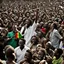 Placeholder: A vibrant and energetic concert performance by Lucky Dube, with a large crowd of enthusiastic fans dancing and singing along to his reggae music.spirit.energy and beauty of this moment.