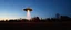 Placeholder: flying saucer ufo in autumn evening field shooting a cone of light upwards to the sky down to another sauver