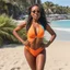 Placeholder: Aisha Tyler reaches extreme relax on the beach in her yse Paris swimsuit