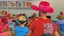 Placeholder: many men wearing red trucker hats enjoy the drag queen story hour