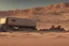 Placeholder: A Tesla 'Semi' (semi truck) is parked, in Mos Eisley on the planet Tatooine. (CINEMATIC, WIDE ANGLE LENS, PHOTO REAL)