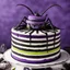 Placeholder: Beetlejuice style image featuring a stripped cockroach birthday cake inspired by Tim Burton with vibrant Purple, black, lime green, and white highlights