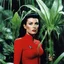 Placeholder: [high res photo by Helmut Newton] a woman Star Trek red shirt surprised by tendrils and she realizes too late that there are very agressive carnivorous plants around her. In few moments she disappears inside the plant