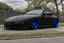 Placeholder: black Porsche 944 with tinted windows matte black paint with electric blue underglow